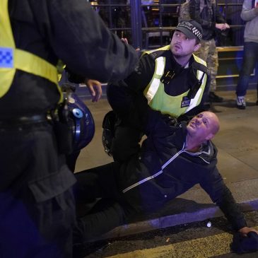 Far-right thugs, soccer hooligans blamed for violence at London march