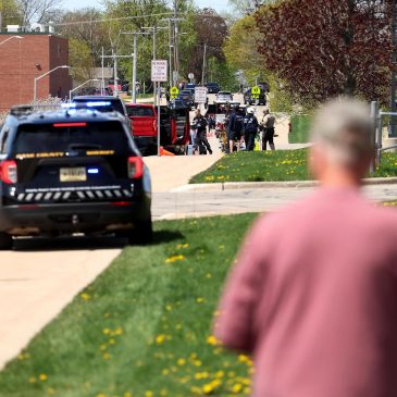 Investigators say student killed by police outside Wisconsin school had pointed pellet rifle