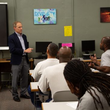 Secretary of State Steve Simon meets with inmates about law restoring voting rights