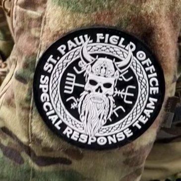 Officers in Minneapolis raid wore distinct patches. One was authorized, another wasn’t, feds say.