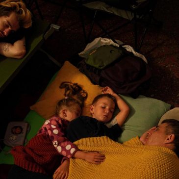 Ukraine’s capital buzzes during the day but it’s a battleground at night