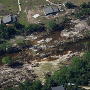 Searchers in helicopters and on horseback comb Texas flood debris for missing people
