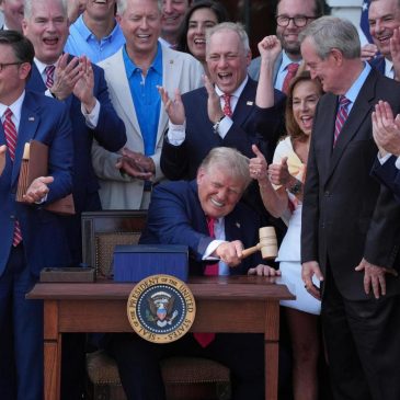 Trump signs his tax and spending cut bill at the White House July 4 picnic