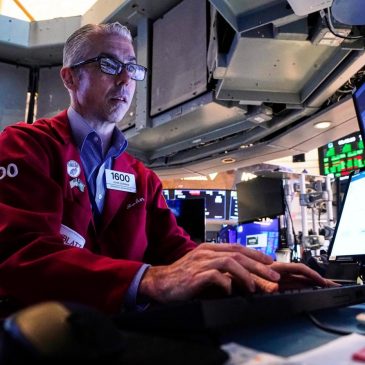 Tesla tumbles and Alphabet rises to keep Wall Street near its records