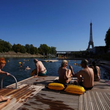 The Seine in Paris is open for swimming. Tourists and residents embrace it as temperatures soar