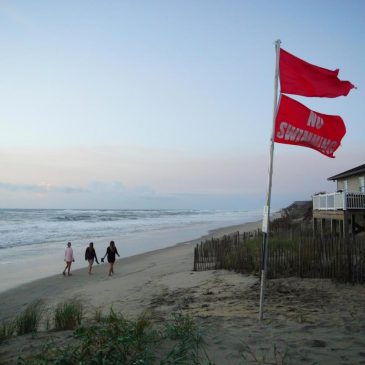 Summer celebrations meet closed beaches and warnings on US East Coast due to Hurricane Erin