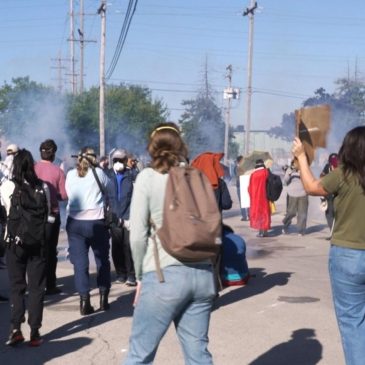 Federal agents fire chemicals as protesters try to block car at immigration site outside Chicago