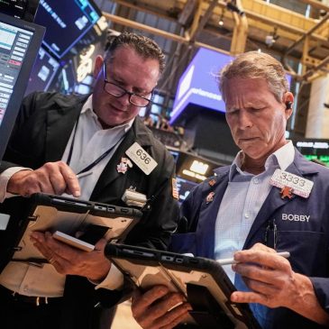 Wall Street holds near its record heights