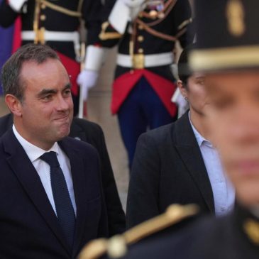 Strikes and protests roil France, pitting the streets against Macron and his new prime minister