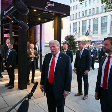 Trump having dinner at a restaurant near the White House to promote his Washington crackdown