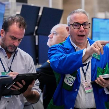 Wall Street climbs after report shows prices rose less than feared, boosting chances for a rate cut