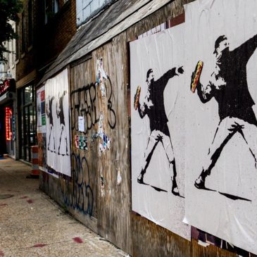 The man who threw a sandwich at a federal agent says it was a protest. Prosecutors say it’s a crime