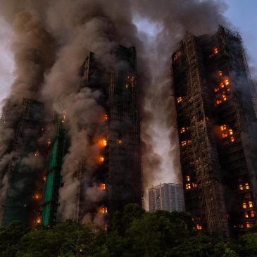 At least 13 dead after fire engulfs Hong Kong high-rise residential buildings