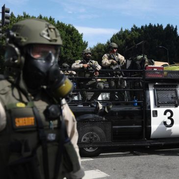 Trump administration sues California over law banning masked federal agents