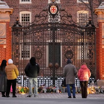 Authorities knock on doors and seek evidence in the search for the Brown University shooter