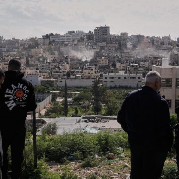 Palestinians watch as Israeli bulldozers claw down their West Bank homes
